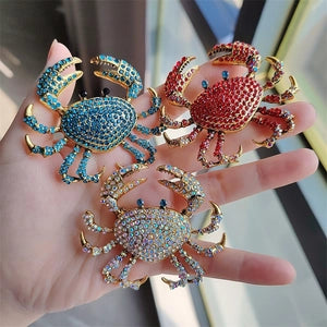 Sparkling rhinestone crab brooches in red, blue and iridescent colors