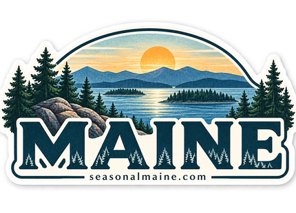 Maine Sunset Lake Landscape sticker artwork. An arched landscape design shows a golden sunset over blue mountains, a lake and pine-covered islands, framed by evergreens and rocks above oversized navy MAINE lettering with small tree silhouettes.