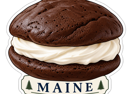 Maine Whoopie Pie sticker artwork. A large chocolate whoopie pie with white cream filling sits above a cream Maine label flanked by green pine silhouettes.