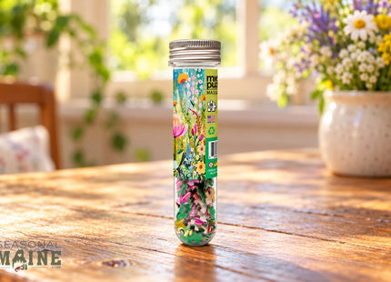 First Pick - Wild Flowers Micro-Puzzle in a styled wooden cottage table setting, with Seasonal Maine logo.
