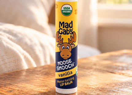 Organic Moose Smooch Lip Balm in a styled bedside table setting, with Seasonal Maine logo.