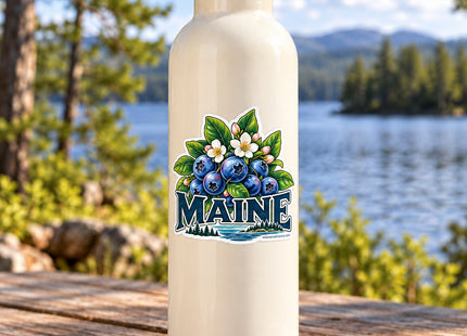 Maine Blueberries and Blossoms Vinyl Sticker – 3 Inch shown on a water bottle in a styled setting, with Seasonal Maine logo. Includes sticker only.