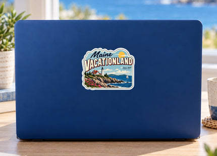 Maine Vacationland Coastal Postcard Vinyl Sticker – 3 Inch shown on a laptop in a styled setting, with Seasonal Maine logo. Includes sticker only.