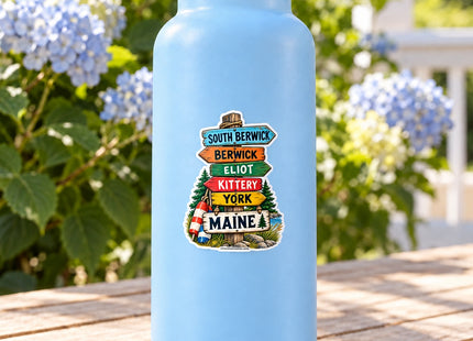 Southern Maine Towns Signpost Vinyl Sticker – 3 Inch shown on a water bottle in a styled setting, with Seasonal Maine logo. Includes sticker only.