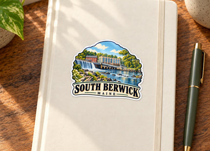 South Berwick Maine Falls Vinyl Sticker – 3 Inch shown on a notebook in a styled setting, with Seasonal Maine logo. Includes sticker only.