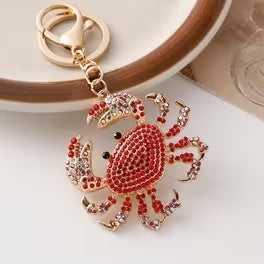Sparkling red crab keychain and bag charm with gold-tone hardware